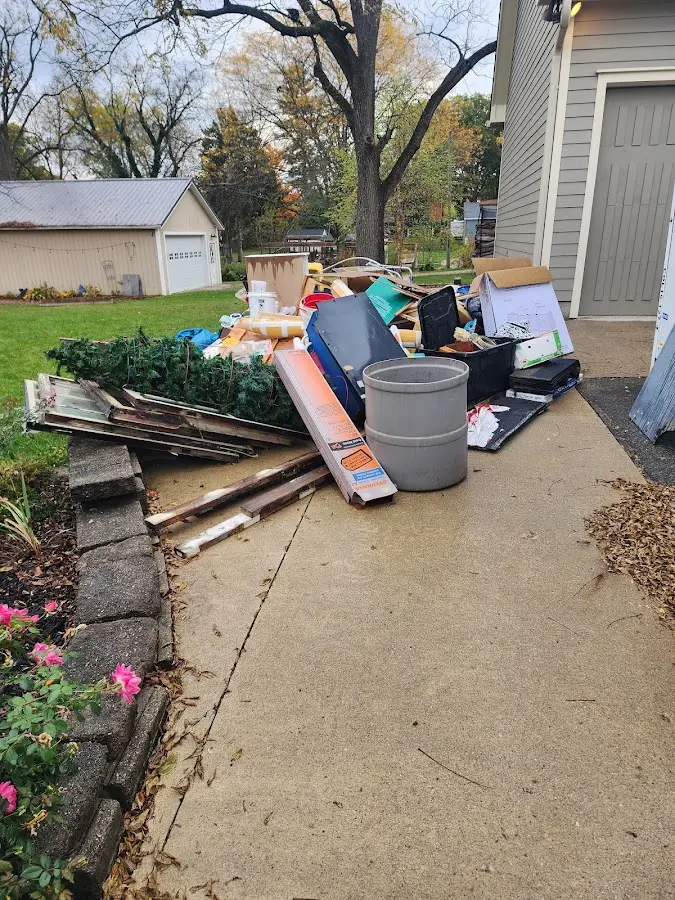 Dumpster being loaded with debris for 30 Yard Dumpster Rental in Royse City